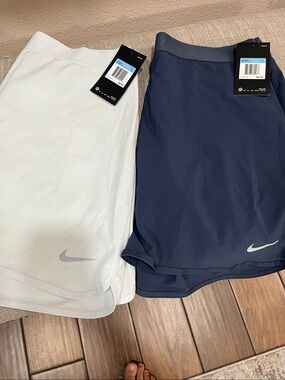 2 Nike pistachio and navy blue Performance Tennis Skort with Subtle Swoosh